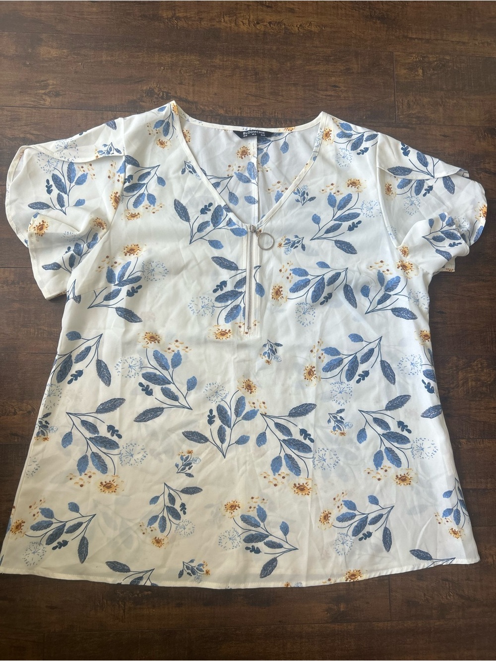 BloomChic White Floral V-Neck Blouse with Blue and Yellow Accents